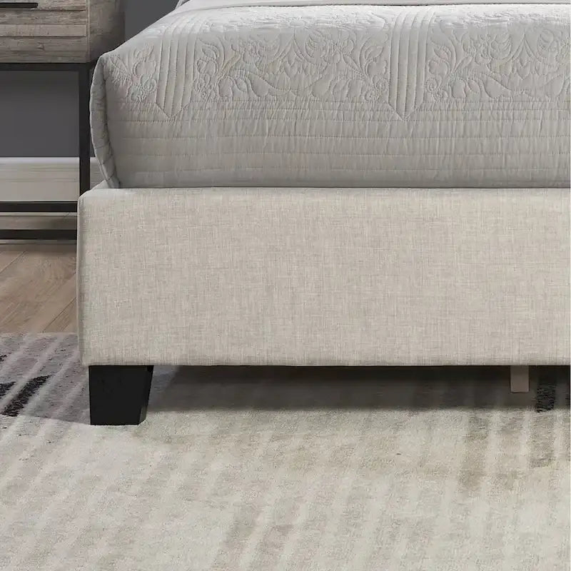 Lit plateforme beige capitonné à oreilles avec boutonnage