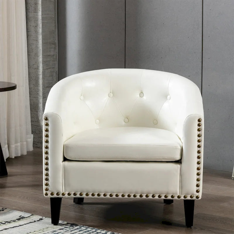 Fauteuil club en similicuir avec accoudoirs encastrés et garniture cloutée