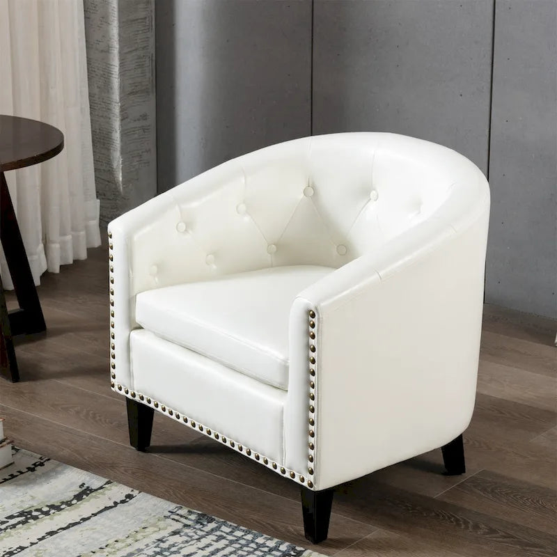 Fauteuil club en similicuir avec accoudoirs encastrés et garniture cloutée