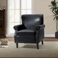 Fauteuil en cuir de transition avec clous décoratifs et accoudoirs roulés